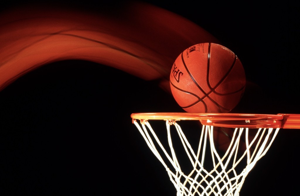 Basketball going through hoop